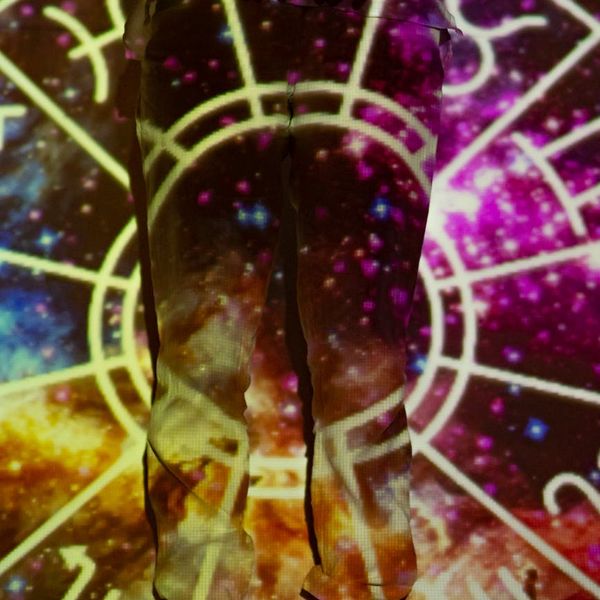 Silhouette of a person in a meditative pose with energy lines.